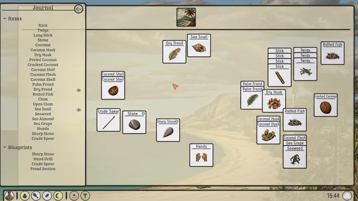 Cards laid out on the beach, with the journal open